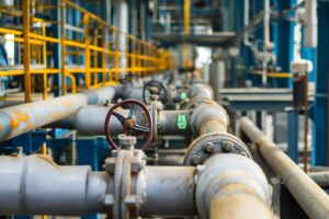 Oil and gas processing plant with pipe line valves, gas compression station