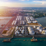 Aerial view tanker and oil storage tank petrochemical oil shipping terminal
